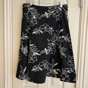 White House Black Market Black Skirt with White Floral Embroidery Design